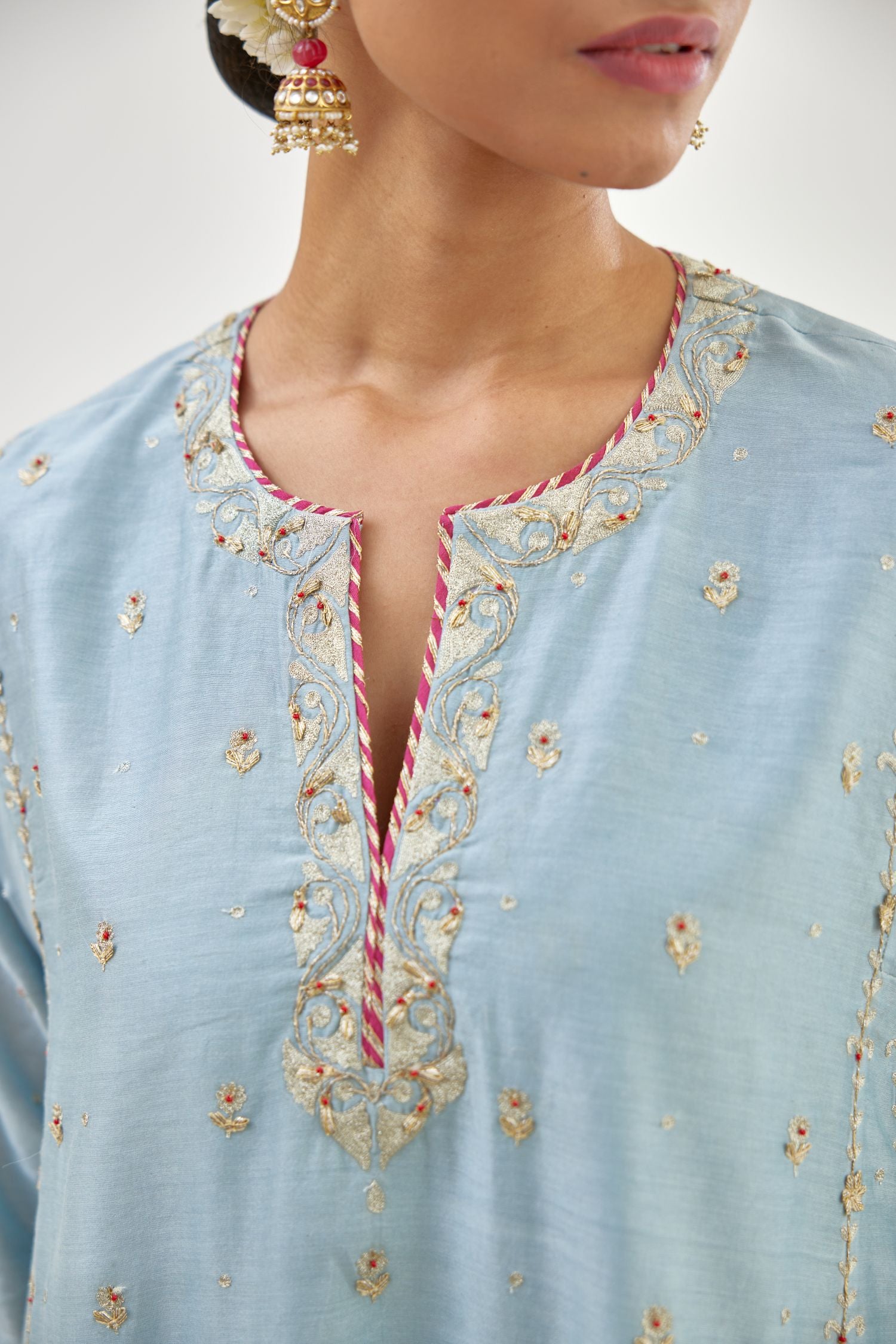 Blue silk chanderi short kalidar kurta set with all-over delicate zari bootis, detailed with dori embroidery and contrast bead work.