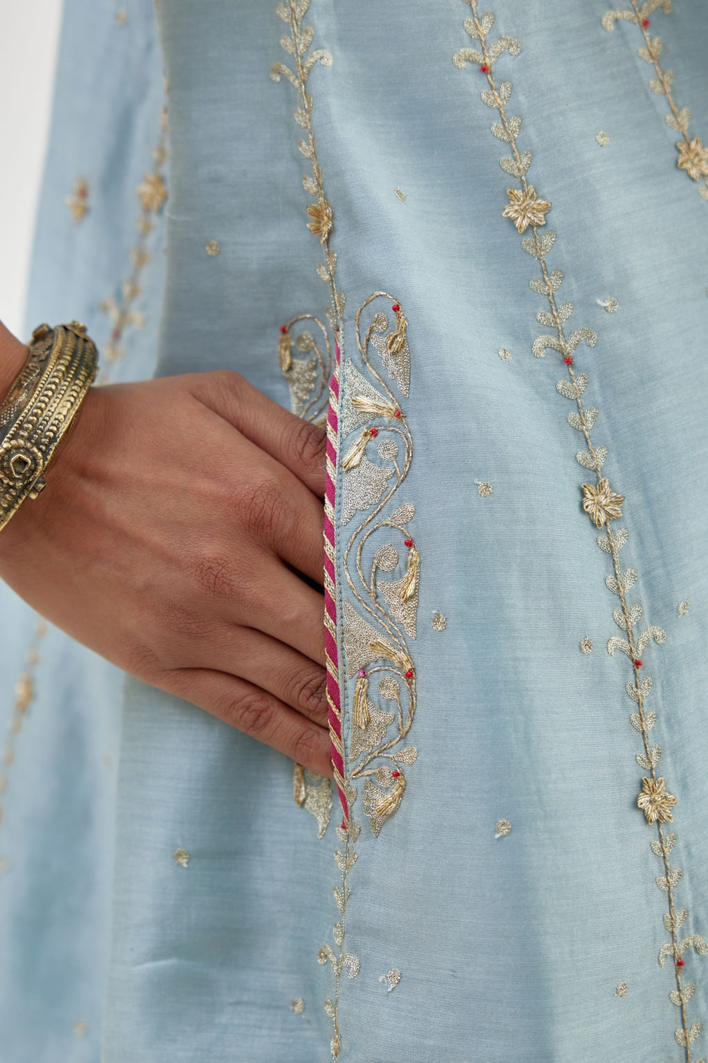 Blue silk chanderi short kalidar kurta set with all-over delicate zari bootis, detailed with dori embroidery and contrast bead work.