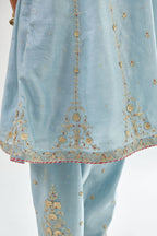Blue silk chanderi short kalidar kurta set with all-over delicate zari bootis, detailed with dori embroidery and contrast bead work.