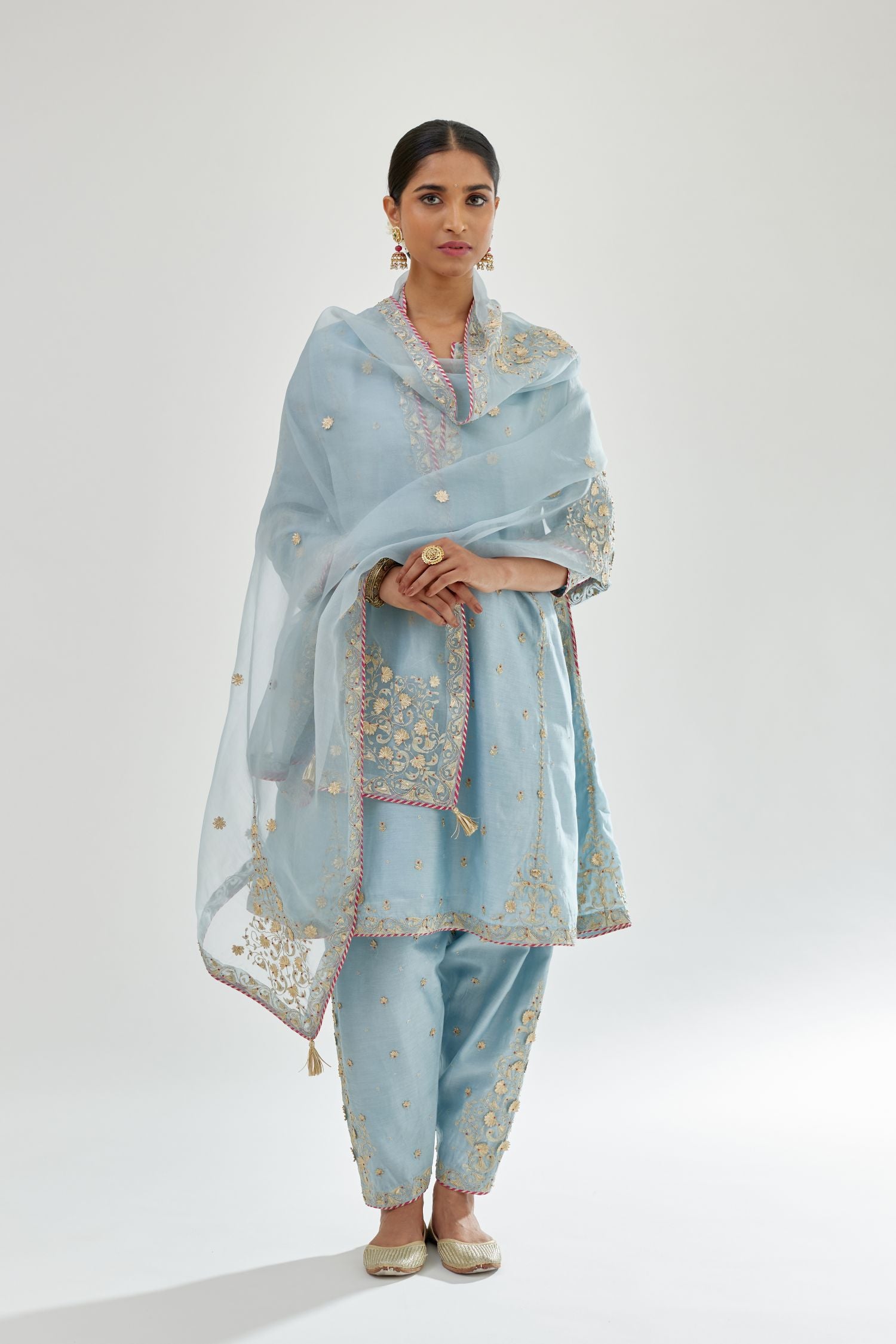 Blue silk chanderi short kalidar kurta set with all-over delicate zari bootis, detailed with dori embroidery and contrast bead work.