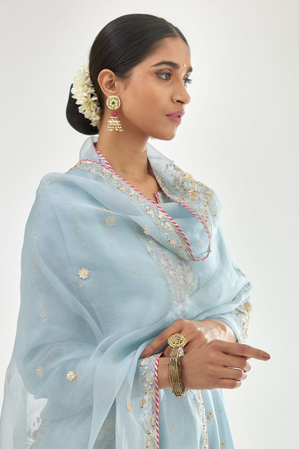 Blue silk chanderi short kalidar kurta set with all-over delicate zari bootis, detailed with dori embroidery and contrast bead work.