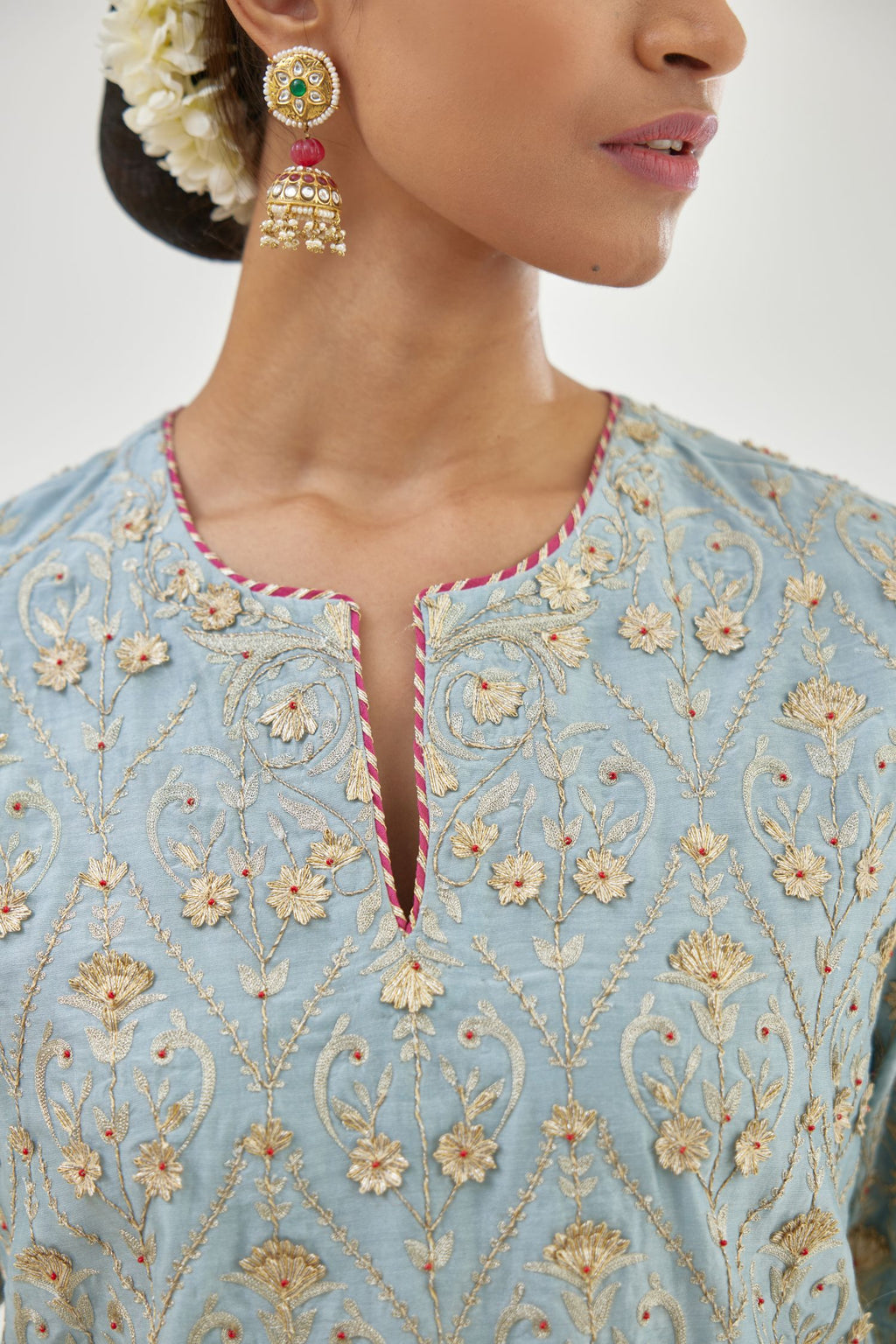 Blue short kurta set detailed with all-over zari, dori, sequins and gota embroidery.