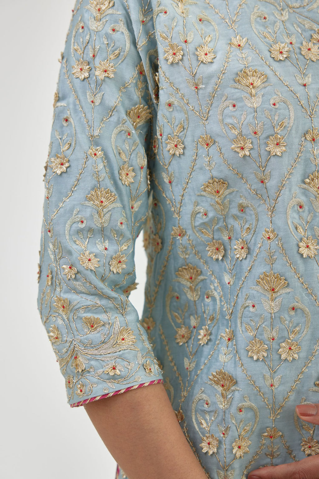 Blue short kurta set detailed with all-over zari, dori, sequins and gota embroidery.