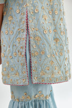 Blue short kurta set detailed with all-over zari, dori, sequins and gota embroidery.