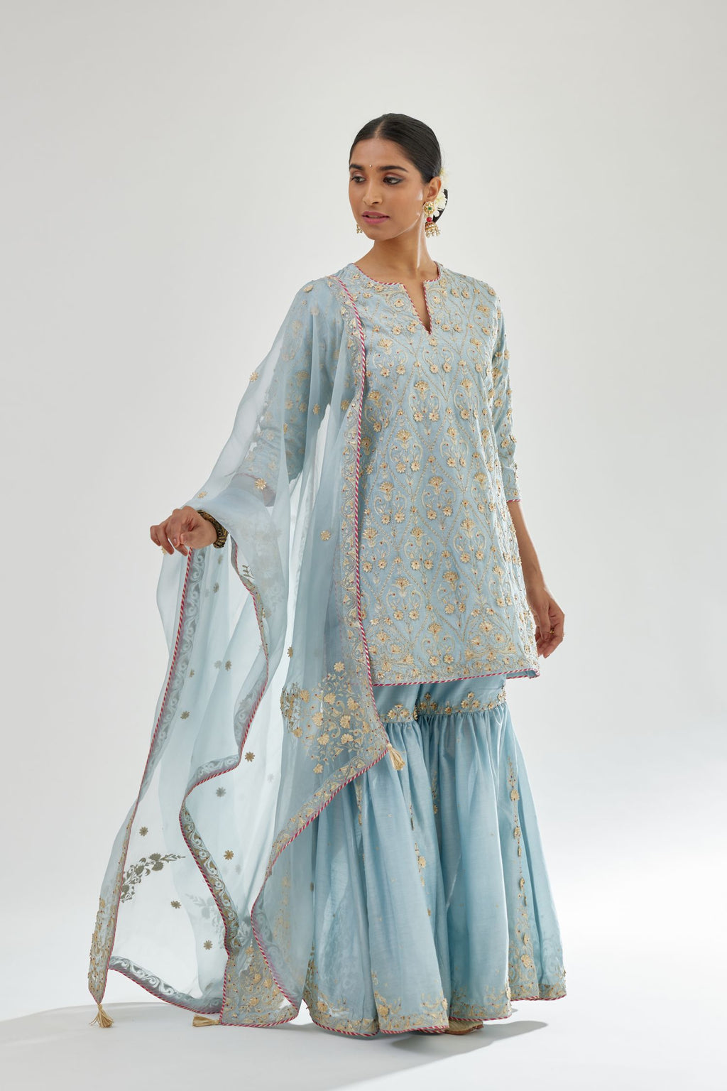 Blue short kurta set detailed with all-over zari, dori, sequins and gota embroidery.