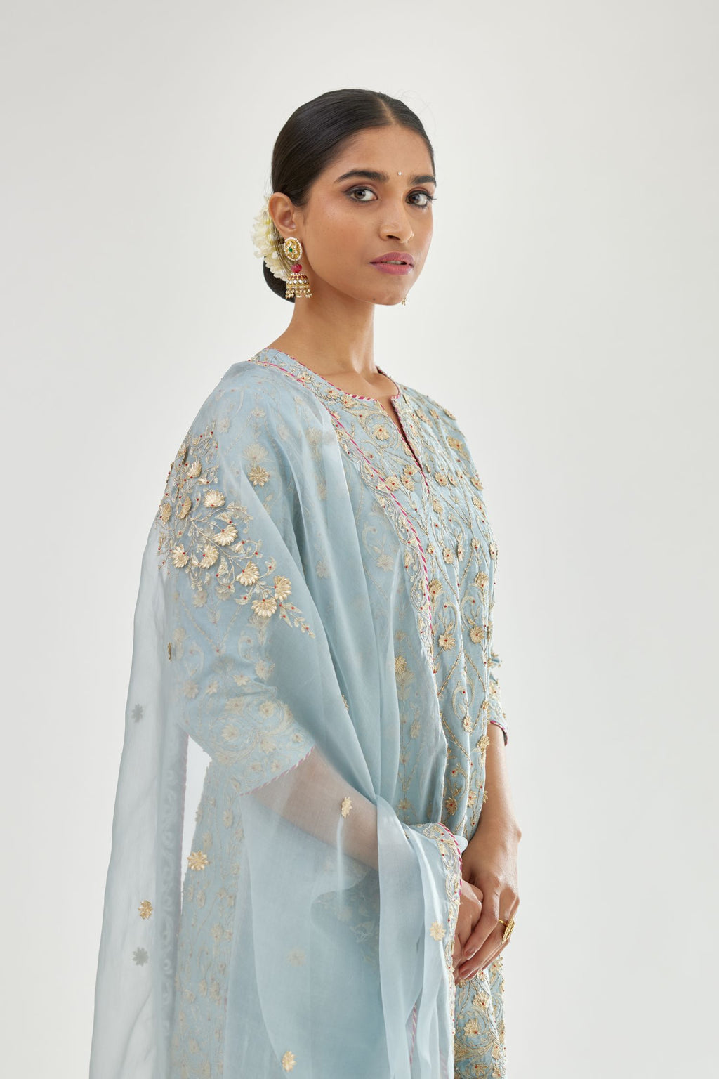 Blue short kurta set detailed with all-over zari, dori, sequins and gota embroidery.