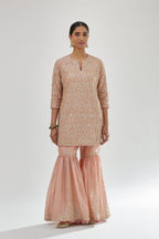 Pink short kurta set detailed with all-over zari, dori, sequins and gota embroidery.