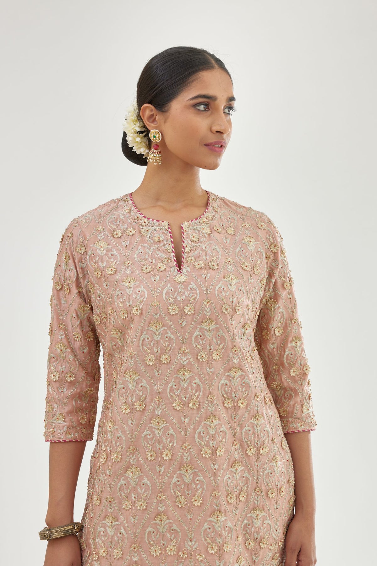 Pink short kurta set detailed with all-over zari, dori, sequins and gota embroidery.