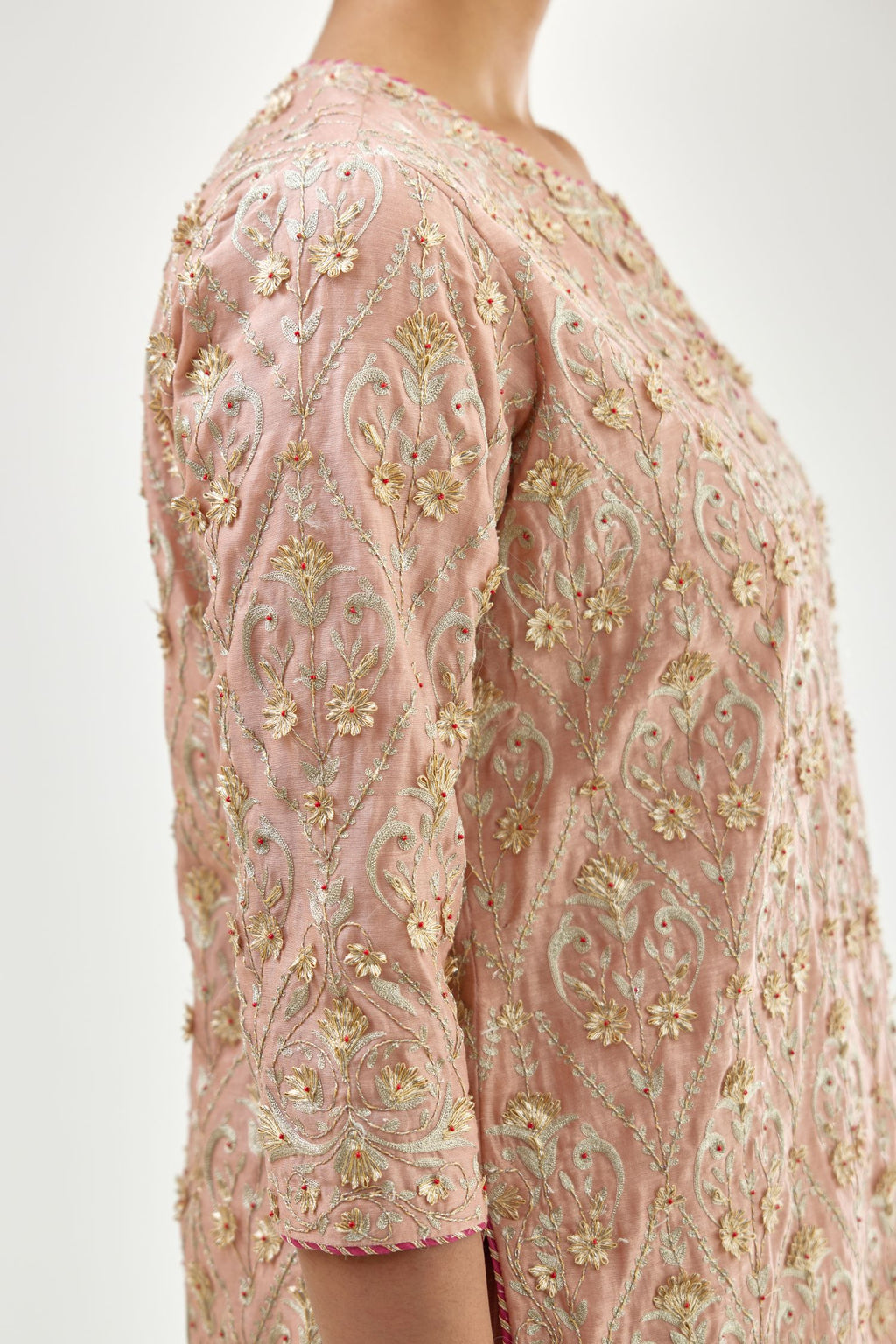 Pink short kurta set detailed with all-over zari, dori, sequins and gota embroidery.
