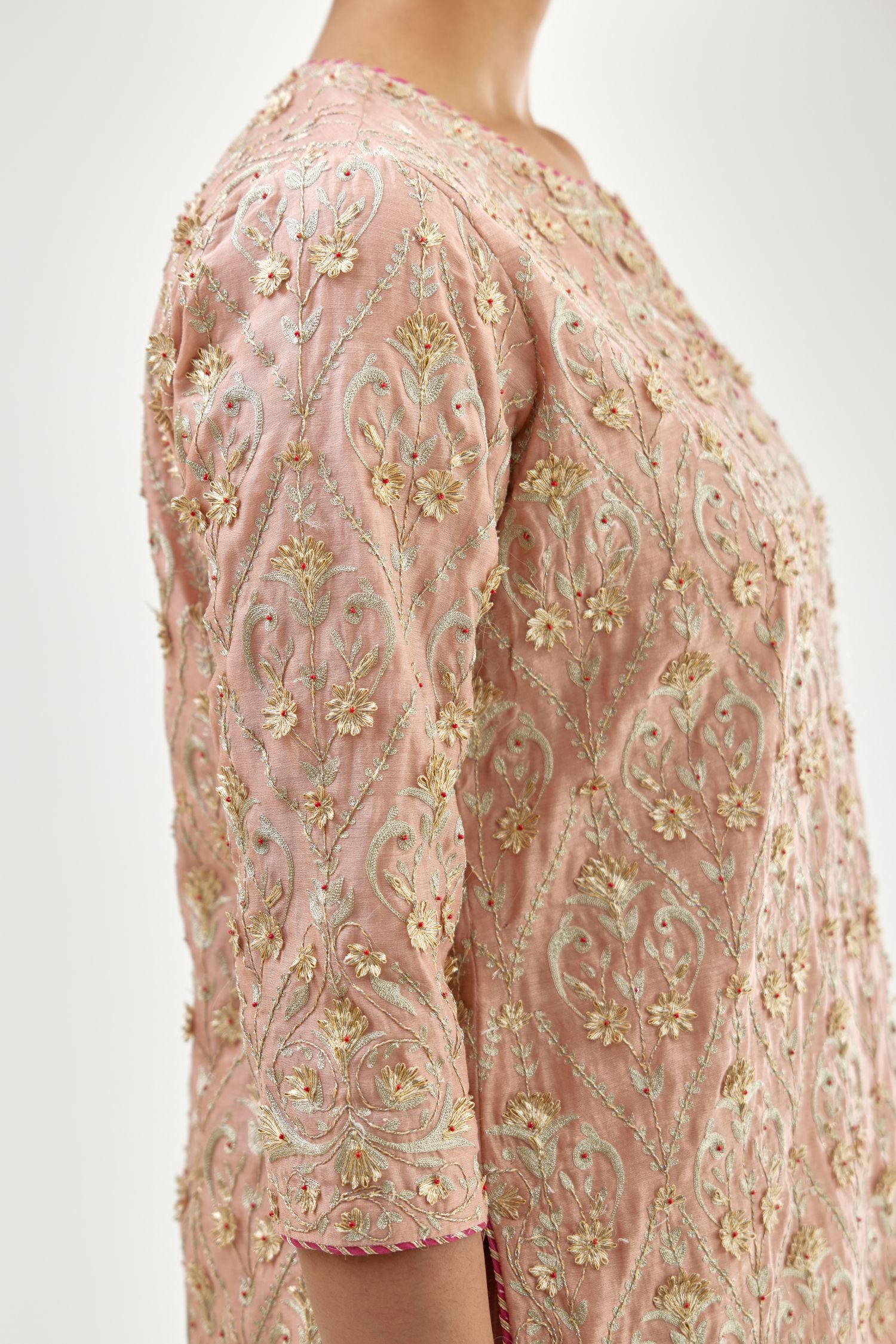 Pink short kurta set detailed with all-over zari, dori, sequins and gota embroidery.