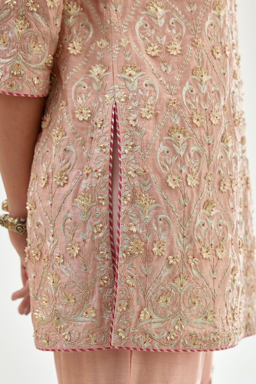 Pink short kurta set detailed with all-over zari, dori, sequins and gota embroidery.