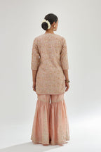 Pink short kurta set detailed with all-over zari, dori, sequins and gota embroidery.