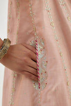 Pink silk chanderi short kalidar kurta set with all-over delicate zari bootis, detailed with dori embroidery and contrast bead work.