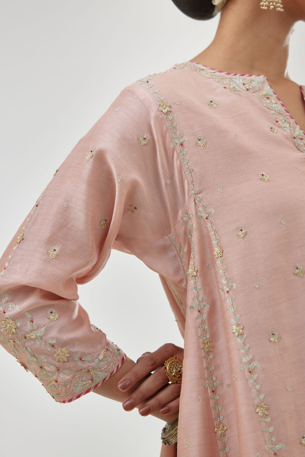 Pink silk chanderi short kalidar kurta set with all-over delicate zari bootis, detailed with dori embroidery and contrast bead work.
