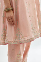 Pink silk chanderi short kalidar kurta set with all-over delicate zari bootis, detailed with dori embroidery and contrast bead work.