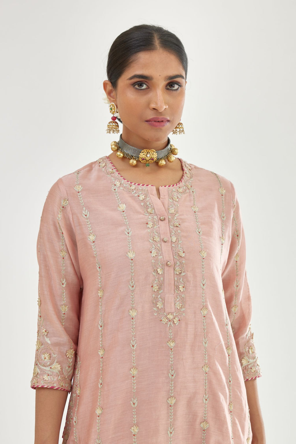 Pink silk chanderi straight kurta set with all over heavy dori and gota embroidery work, highlighted with contrast bead work.