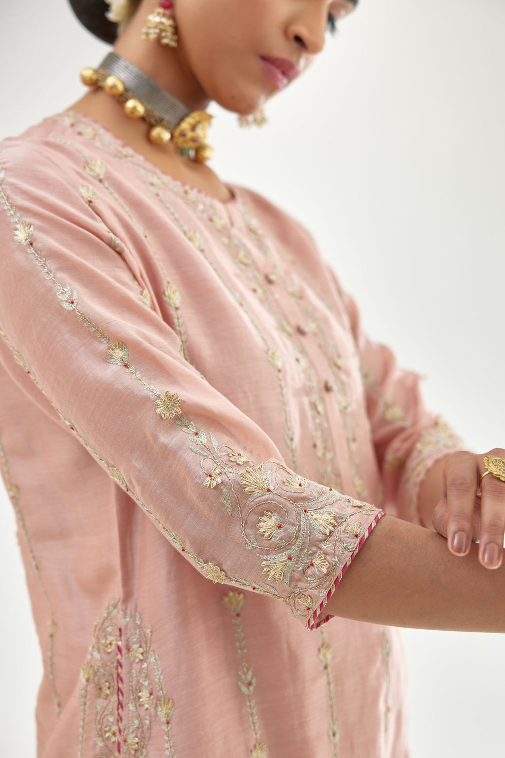 Pink silk chanderi straight kurta set with all over heavy dori and gota embroidery work, highlighted with contrast bead work.