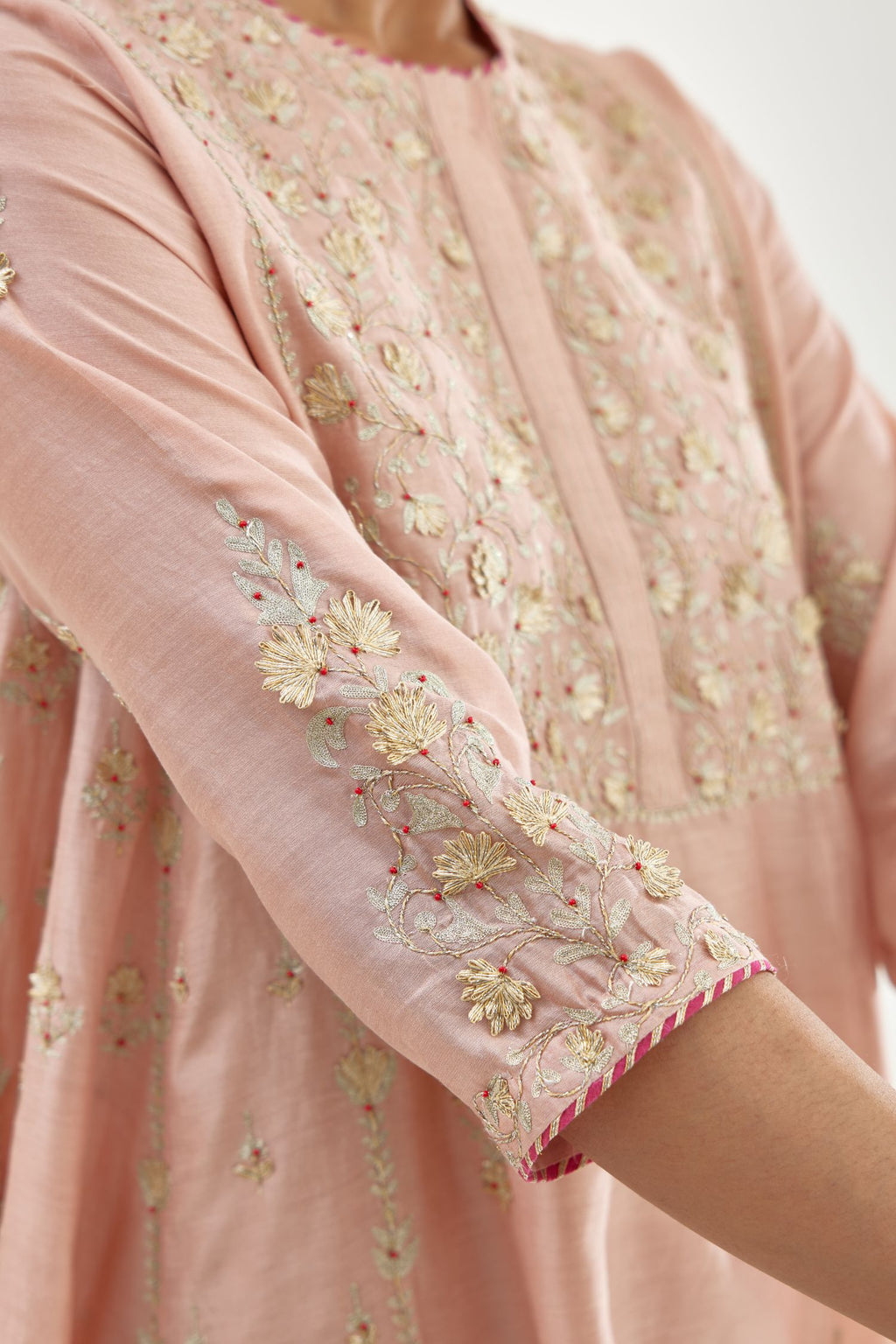 Pink A-line long kurta set with all-over zari, dori, sequins and gota embroidery.