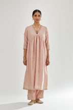 Pink silk chanderi kurta-dress set with zari, dori and gota embroidery, highlighted with contrast bead work.