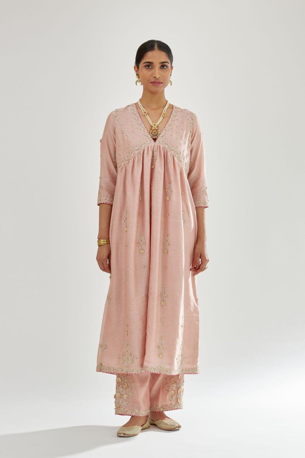 Pink silk chanderi kurta-dress set with zari, dori and gota embroidery, highlighted with contrast bead work.