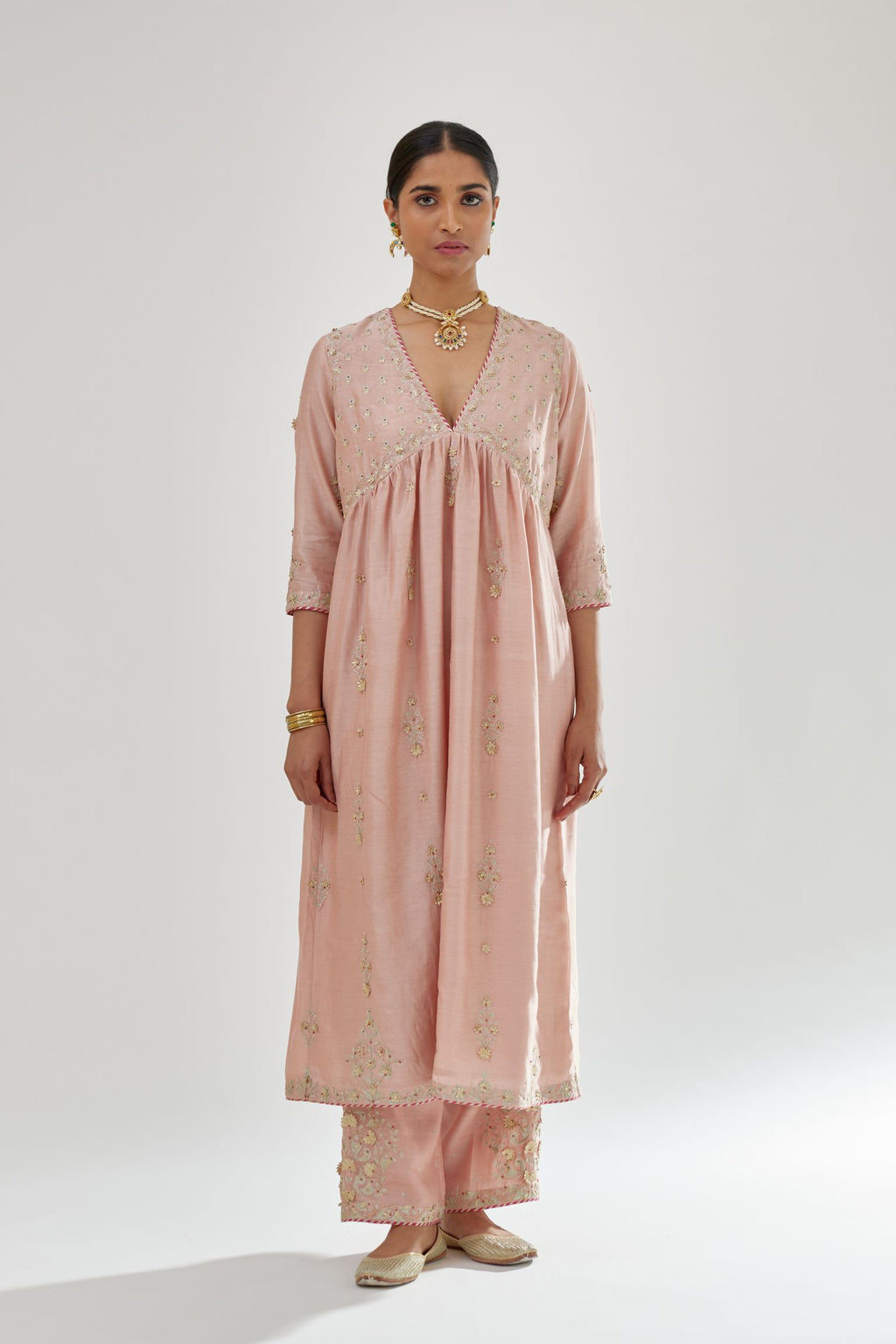 Pink silk chanderi kurta-dress set with zari, dori and gota embroidery, highlighted with contrast bead work.