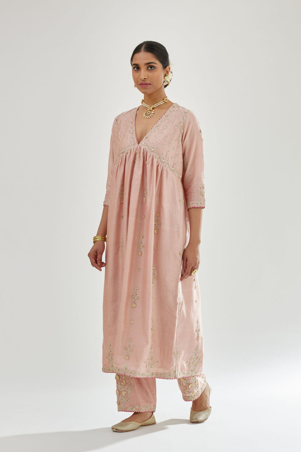 Pink silk chanderi kurta-dress set with zari, dori and gota embroidery, highlighted with contrast bead work.