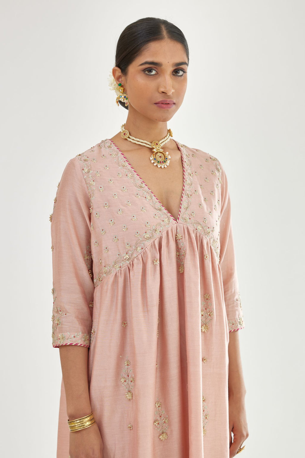 Pink silk chanderi kurta-dress set with zari, dori and gota embroidery, highlighted with contrast bead work.