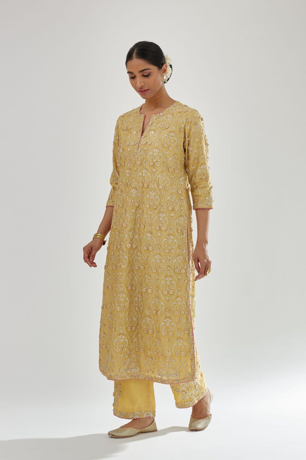 Yellow silk chanderi straight kurta set with all-over dori and gota jaal embroidery, highlighted with contrast bead work.