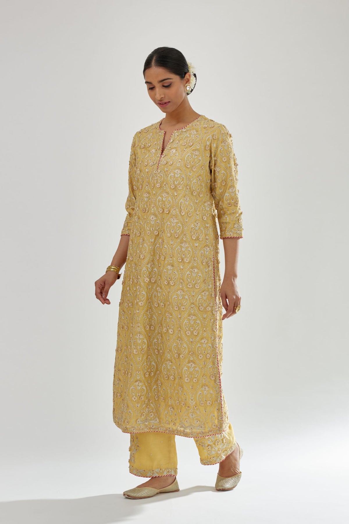 Yellow silk chanderi straight kurta set with all-over dori and gota jaal embroidery, highlighted with contrast bead work.