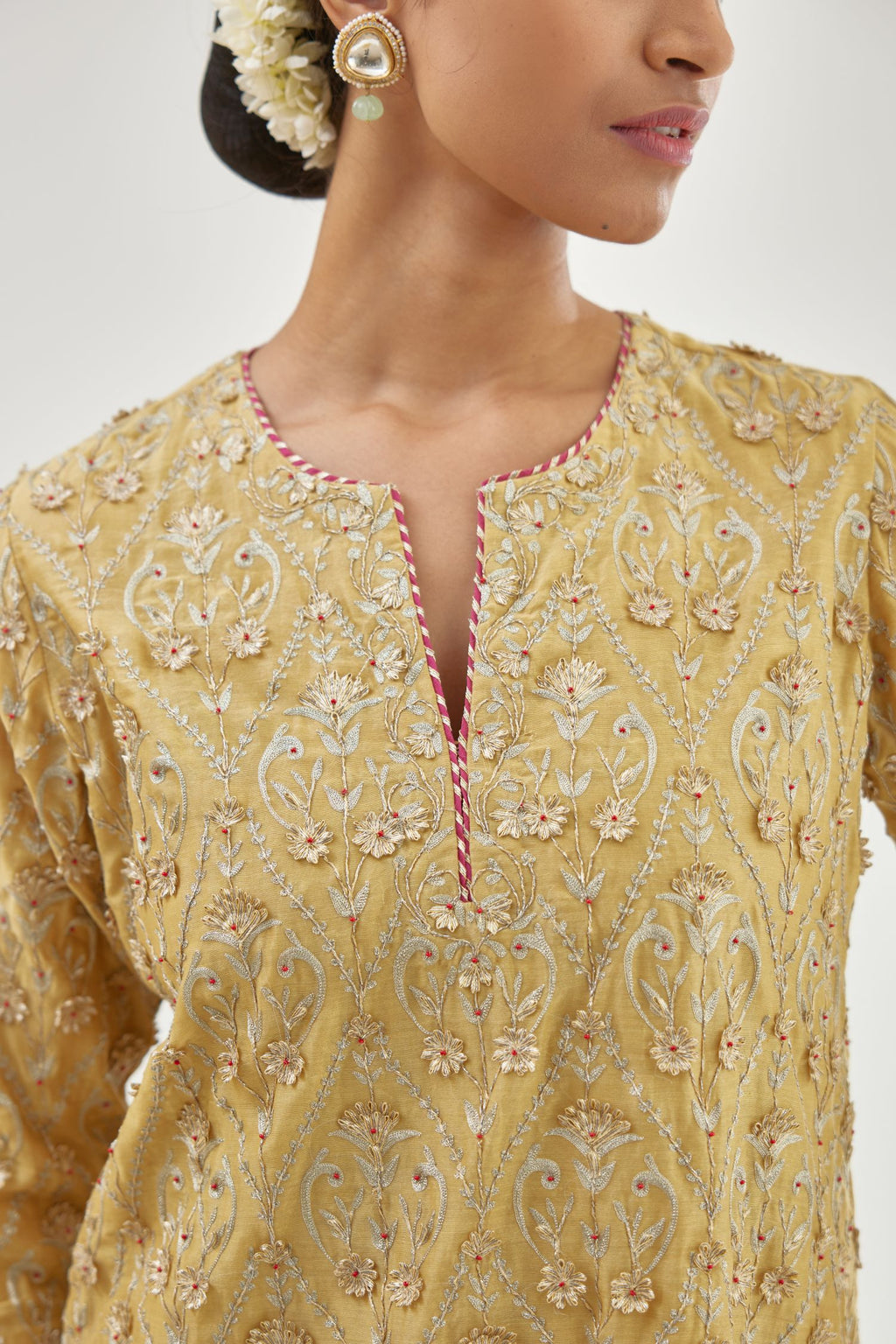 Yellow silk chanderi straight kurta set with all-over dori and gota jaal embroidery, highlighted with contrast bead work.