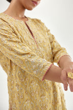 Yellow silk chanderi straight kurta set with all-over dori and gota jaal embroidery, highlighted with contrast bead work.