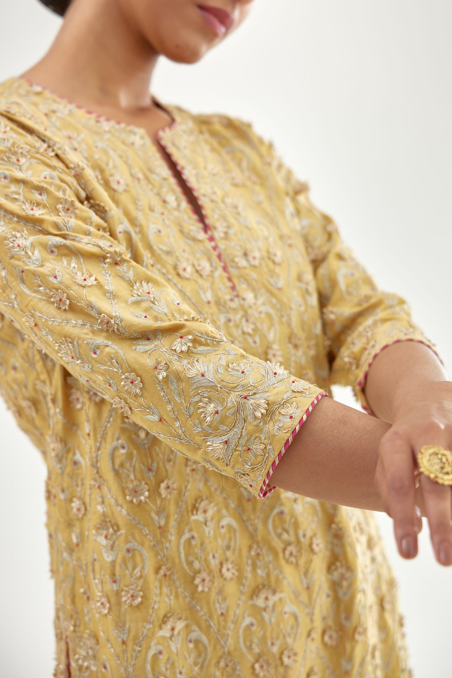 Yellow silk chanderi straight kurta set with all-over dori and gota jaal embroidery, highlighted with contrast bead work.