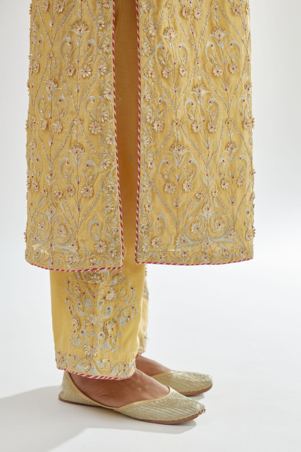 Yellow silk chanderi straight kurta set with all-over dori and gota jaal embroidery, highlighted with contrast bead work.