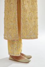 Yellow silk chanderi straight kurta set with all-over dori and gota jaal embroidery, highlighted with contrast bead work.
