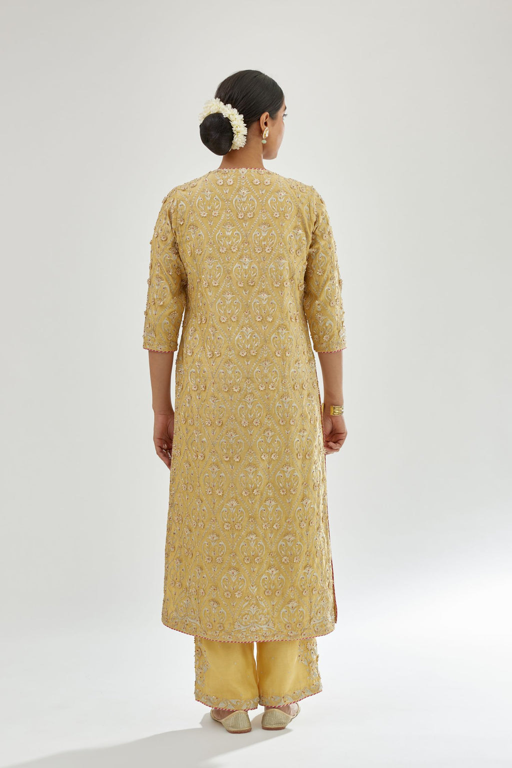 Yellow silk chanderi straight kurta set with all-over dori and gota jaal embroidery, highlighted with contrast bead work.
