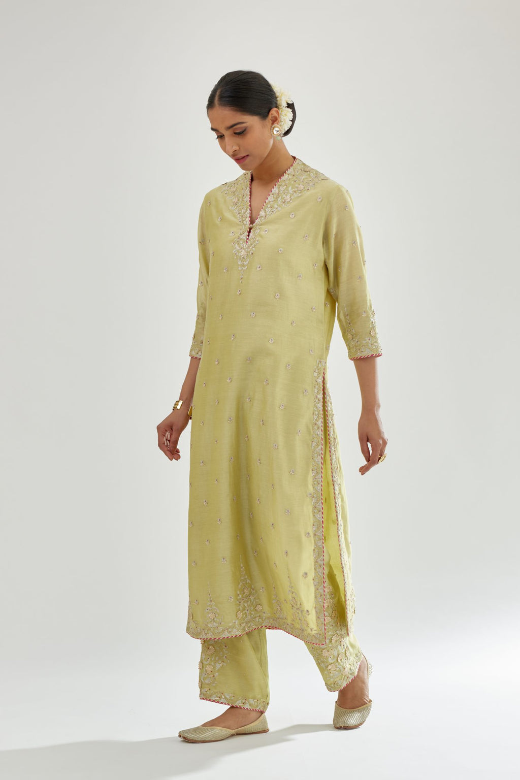 Green silk chanderi straight kurta set with zari, dori and gota embroidery, detailed with all-over delicate aari embroidery buties.