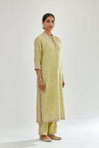 Green silk chanderi straight kurta set with zari, dori and gota embroidery, detailed with all-over delicate aari embroidery buties.