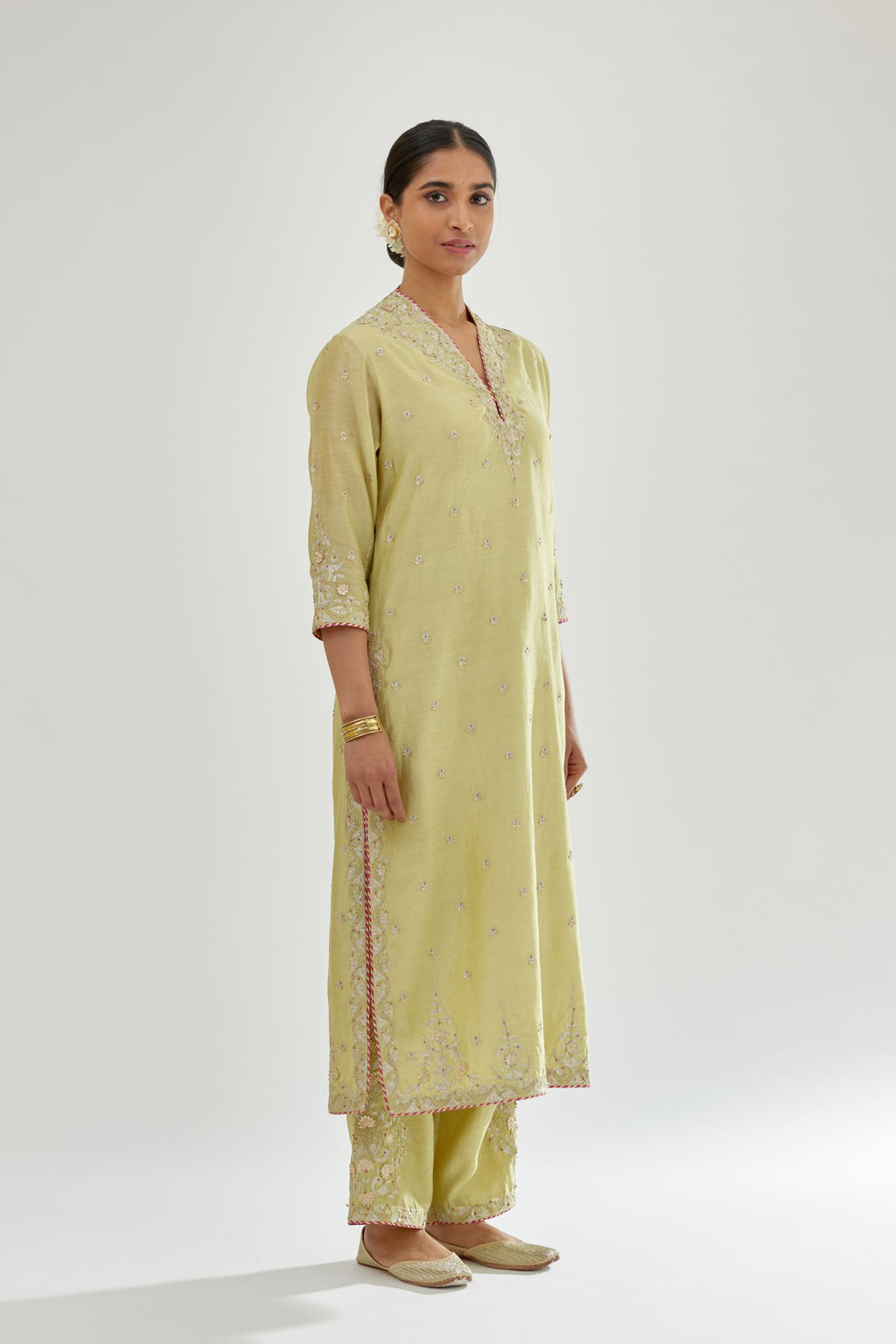 Green silk chanderi straight kurta set with zari, dori and gota embroidery, detailed with all-over delicate aari embroidery buties.