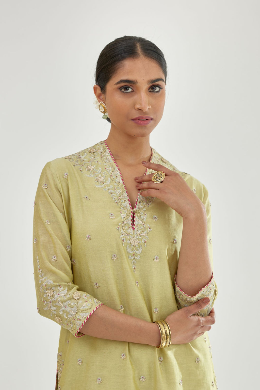 Green silk chanderi straight kurta set with zari, dori and gota embroidery, detailed with all-over delicate aari embroidery buties.