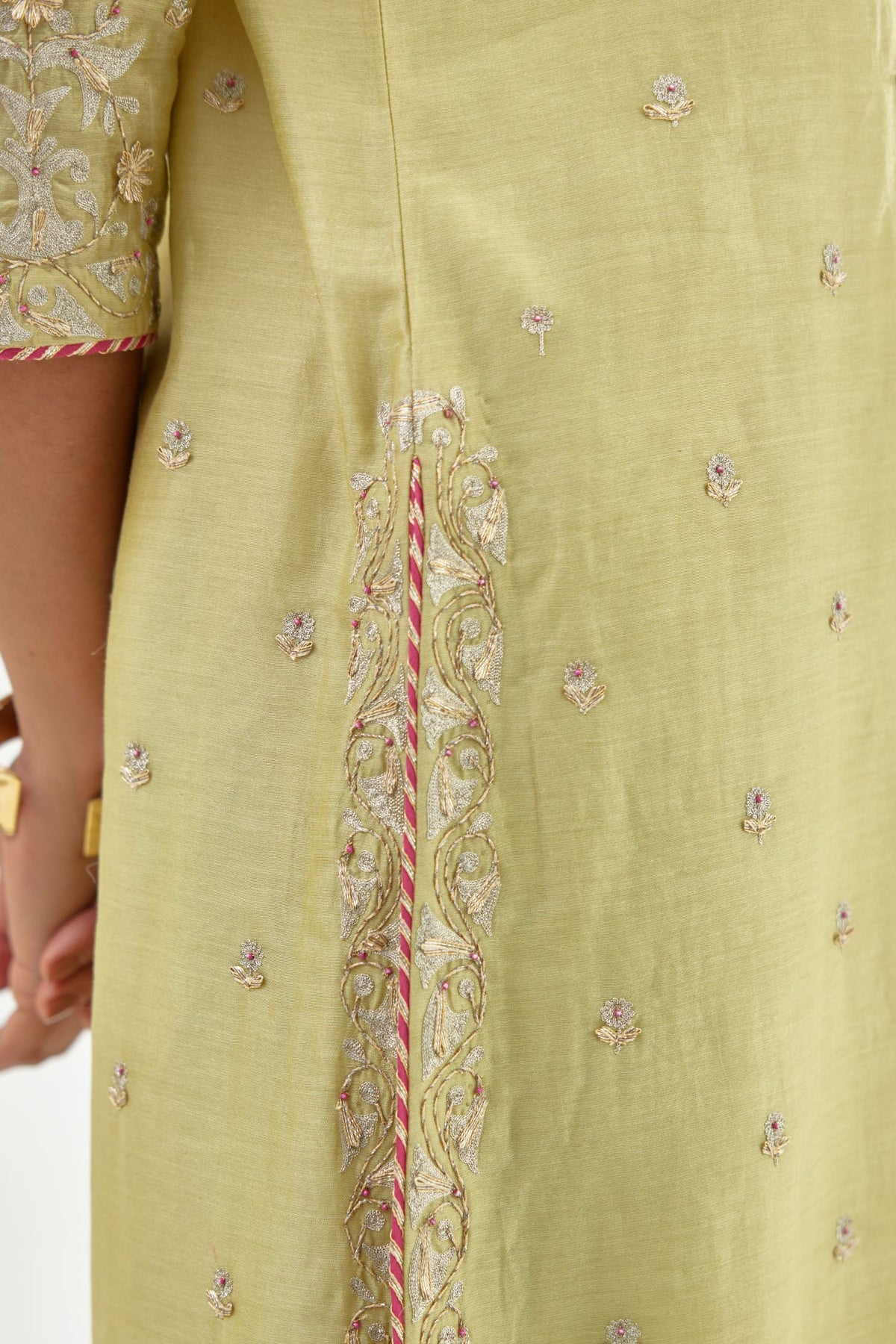 Green silk chanderi straight kurta set with zari, dori and gota embroidery, detailed with all-over delicate aari embroidery buties.