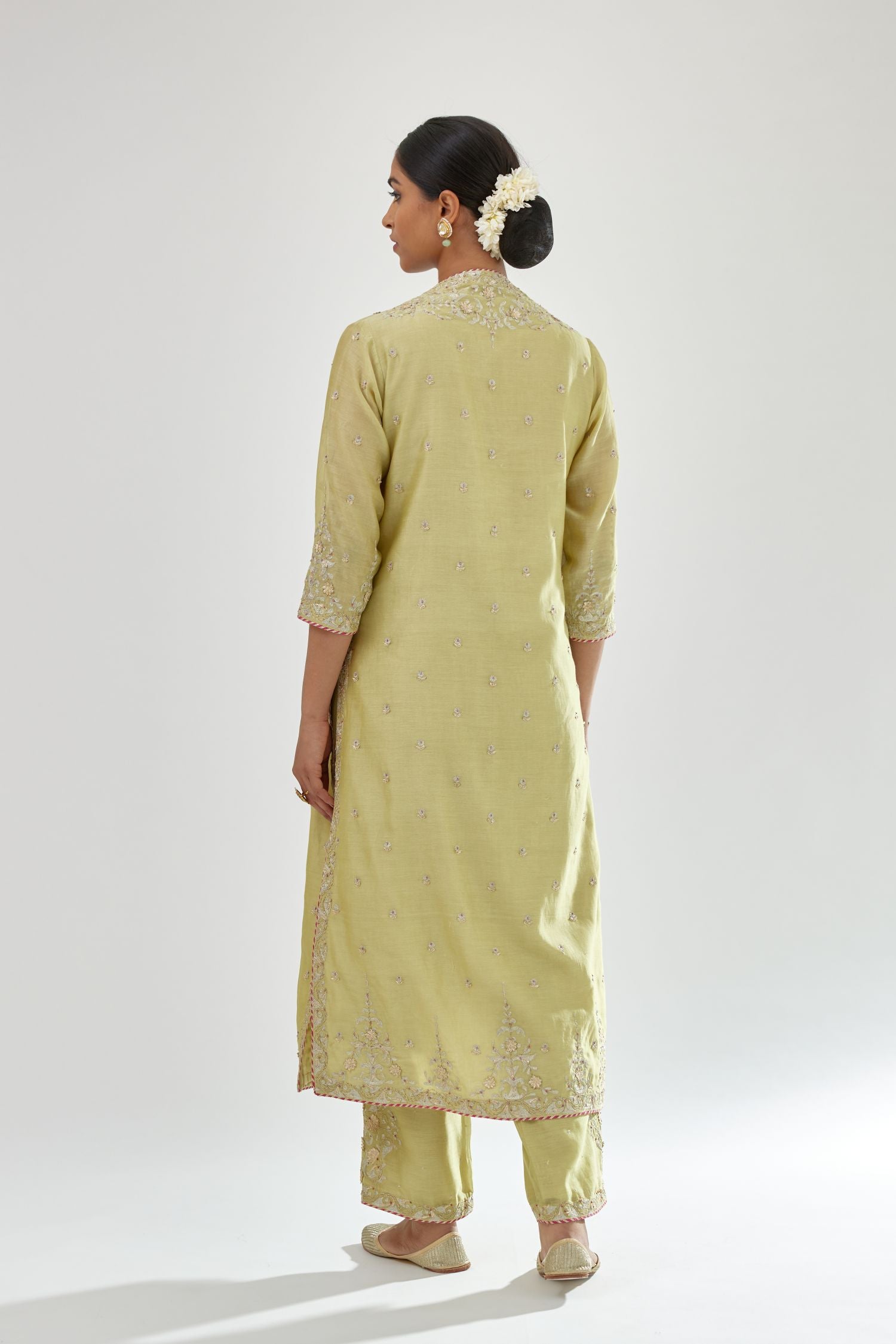 Green silk chanderi straight kurta set with zari, dori and gota embroidery, detailed with all-over delicate aari embroidery buties.