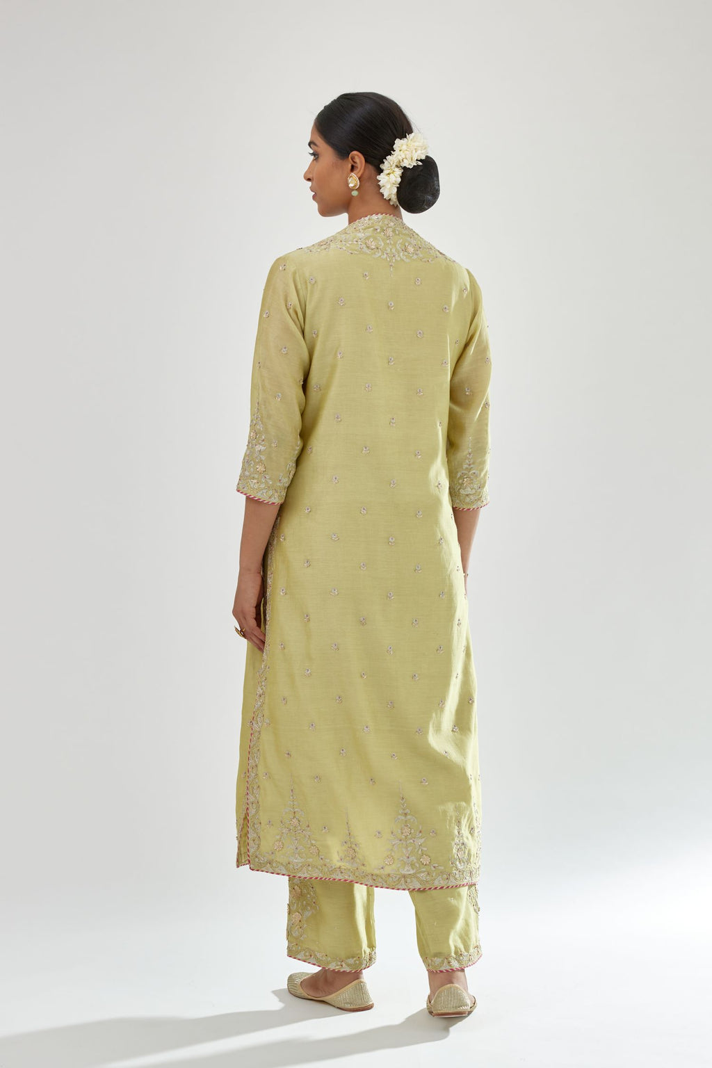 Green silk chanderi straight kurta set with zari, dori and gota embroidery, detailed with all-over delicate aari embroidery buties.