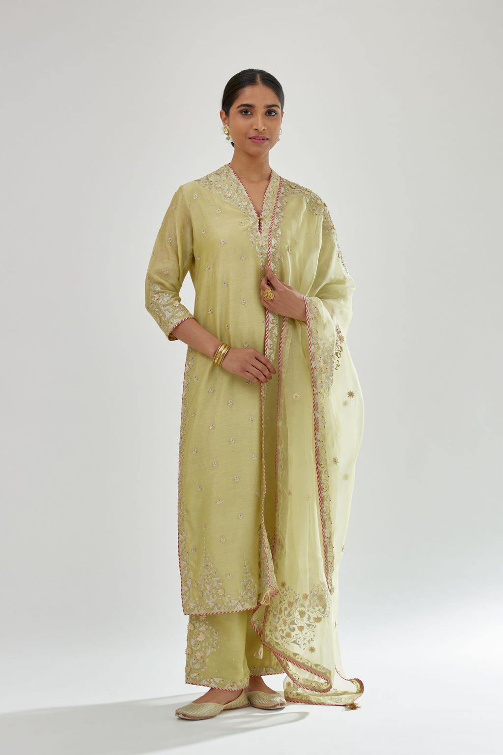 Green silk chanderi straight kurta set with zari, dori and gota embroidery, detailed with all-over delicate aari embroidery buties.