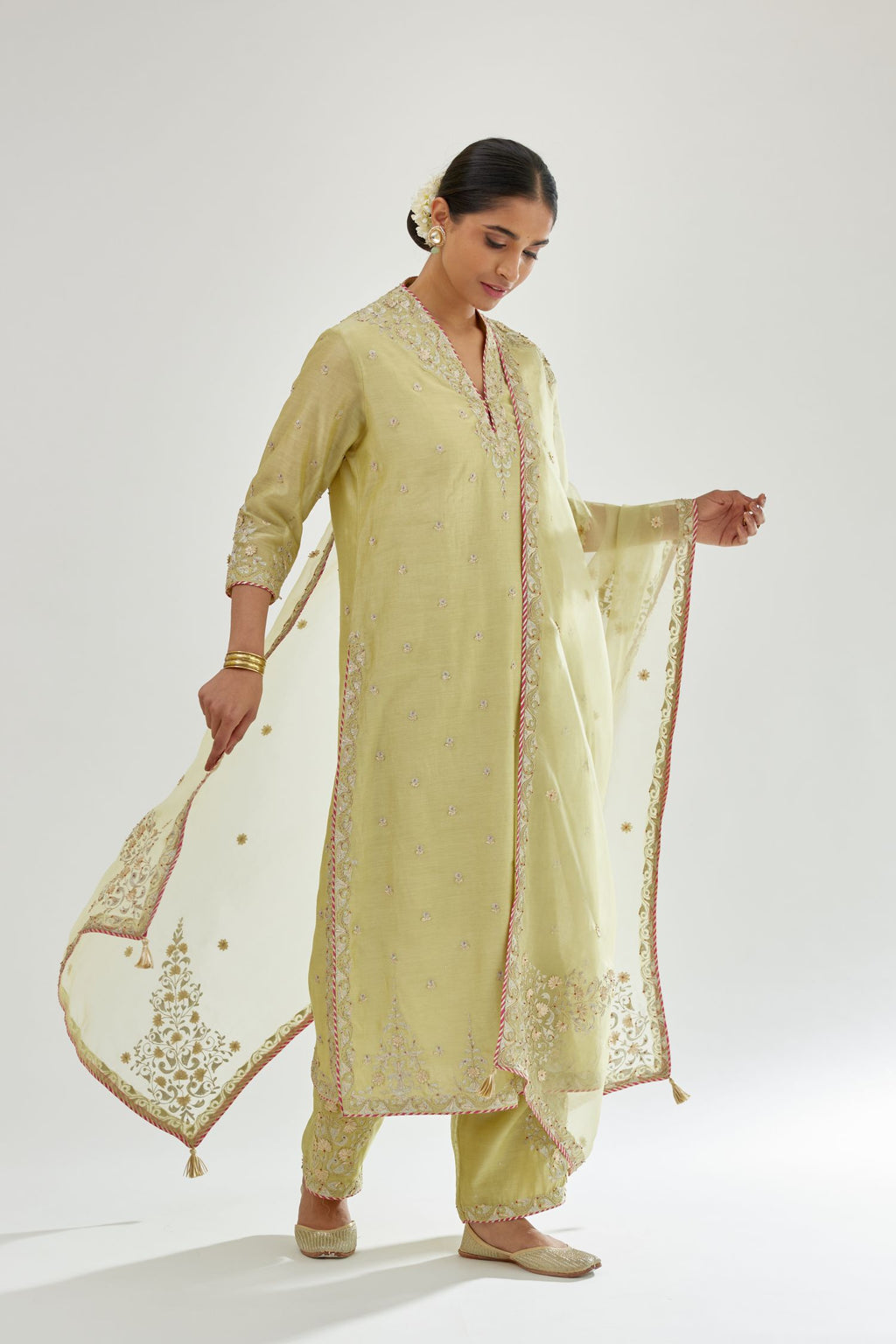 Green silk chanderi straight kurta set with zari, dori and gota embroidery, detailed with all-over delicate aari embroidery buties.