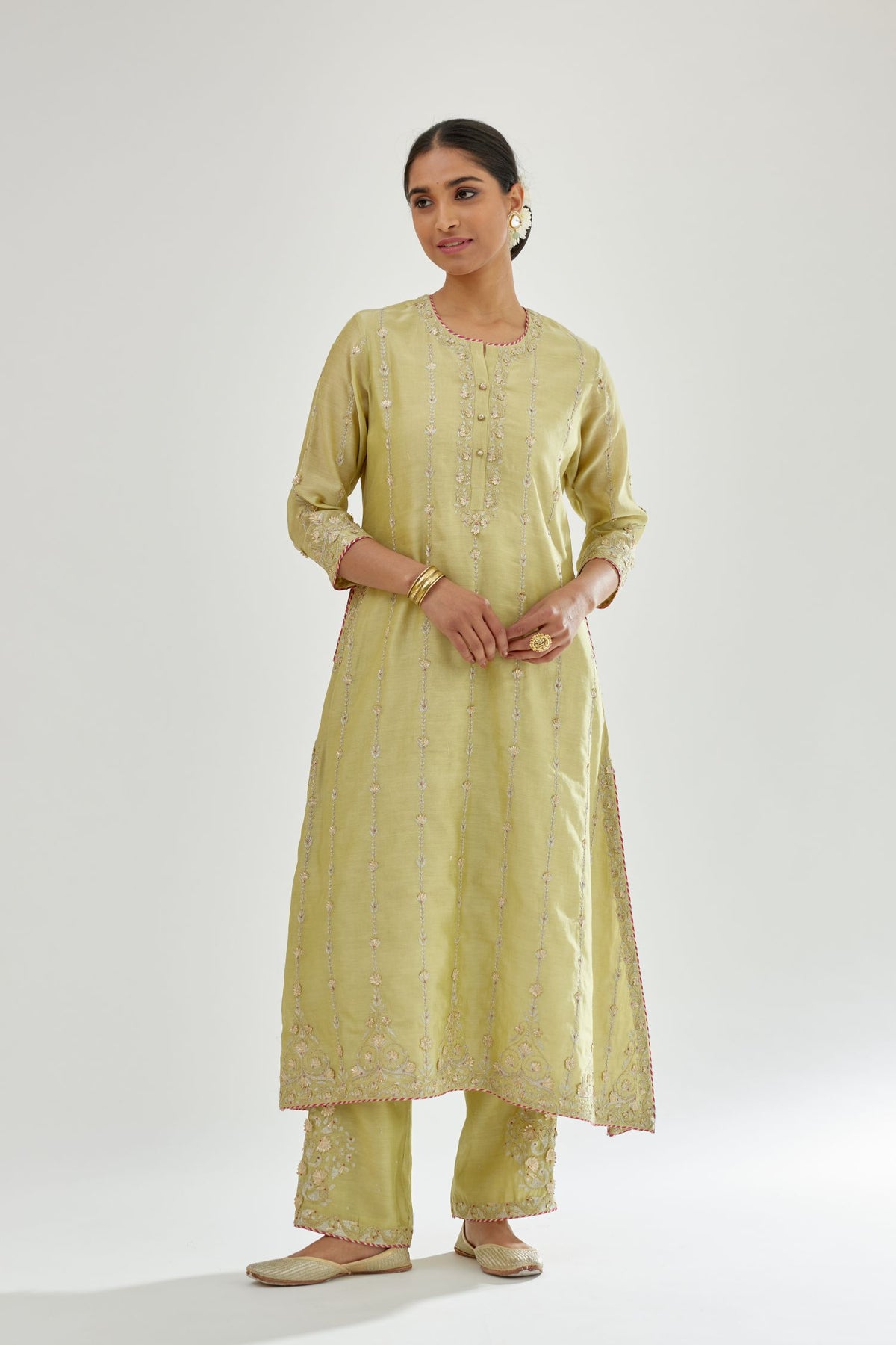 Green silk chanderi straight kurta set with all over heavy dori and gota embroidery work, highlighted with contrast bead work.