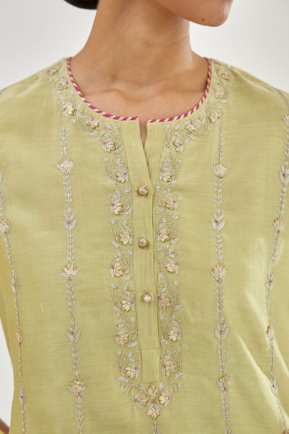 Green silk chanderi straight kurta set with all over heavy dori and gota embroidery work, highlighted with contrast bead work.