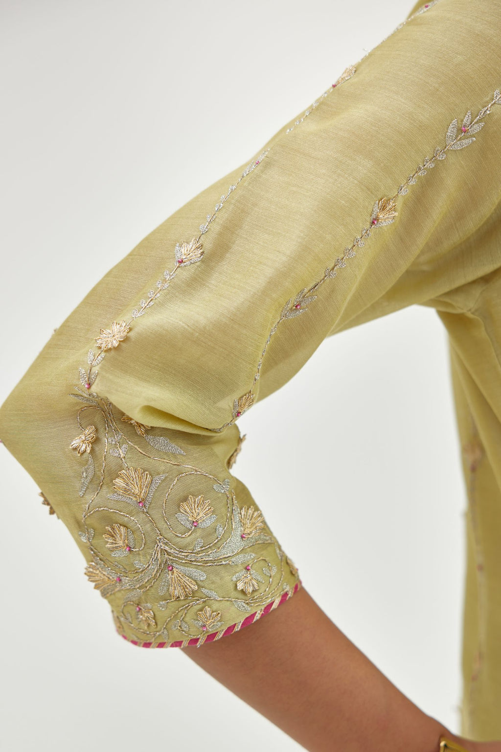 Green silk chanderi straight kurta set with all over heavy dori and gota embroidery work, highlighted with contrast bead work.
