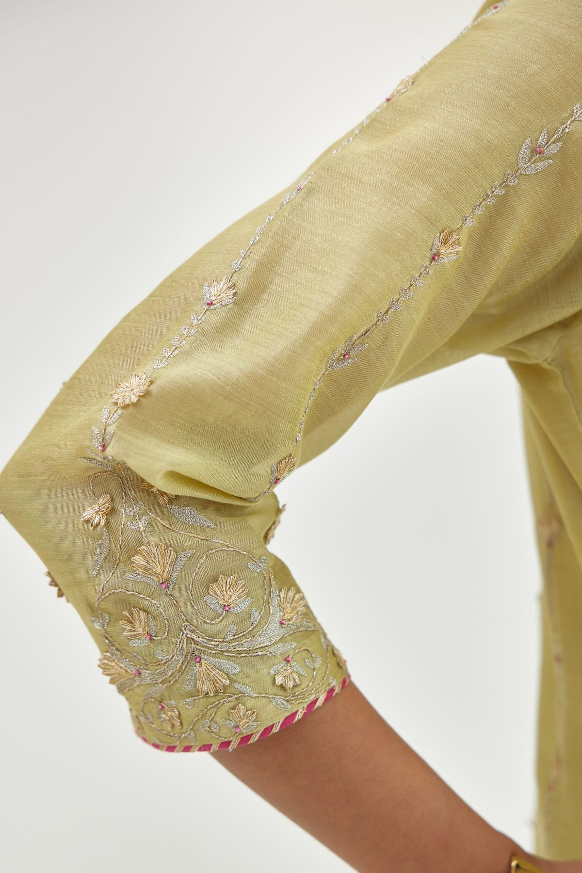 Green silk chanderi straight kurta set with all over heavy dori and gota embroidery work, highlighted with contrast bead work.