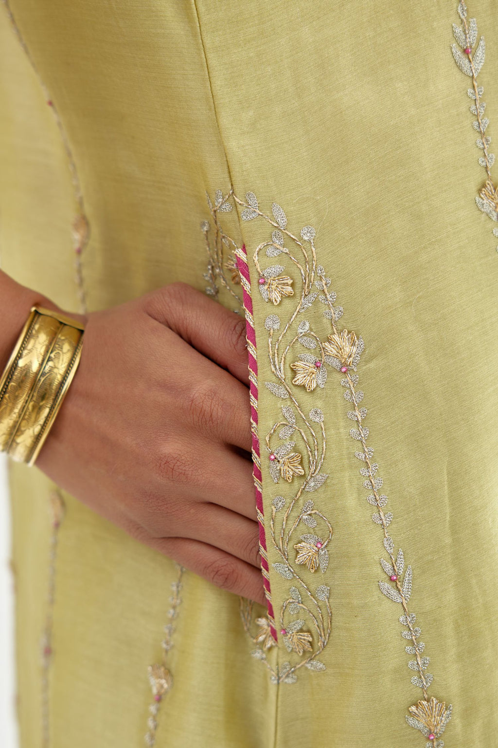 Green silk chanderi straight kurta set with all over heavy dori and gota embroidery work, highlighted with contrast bead work.