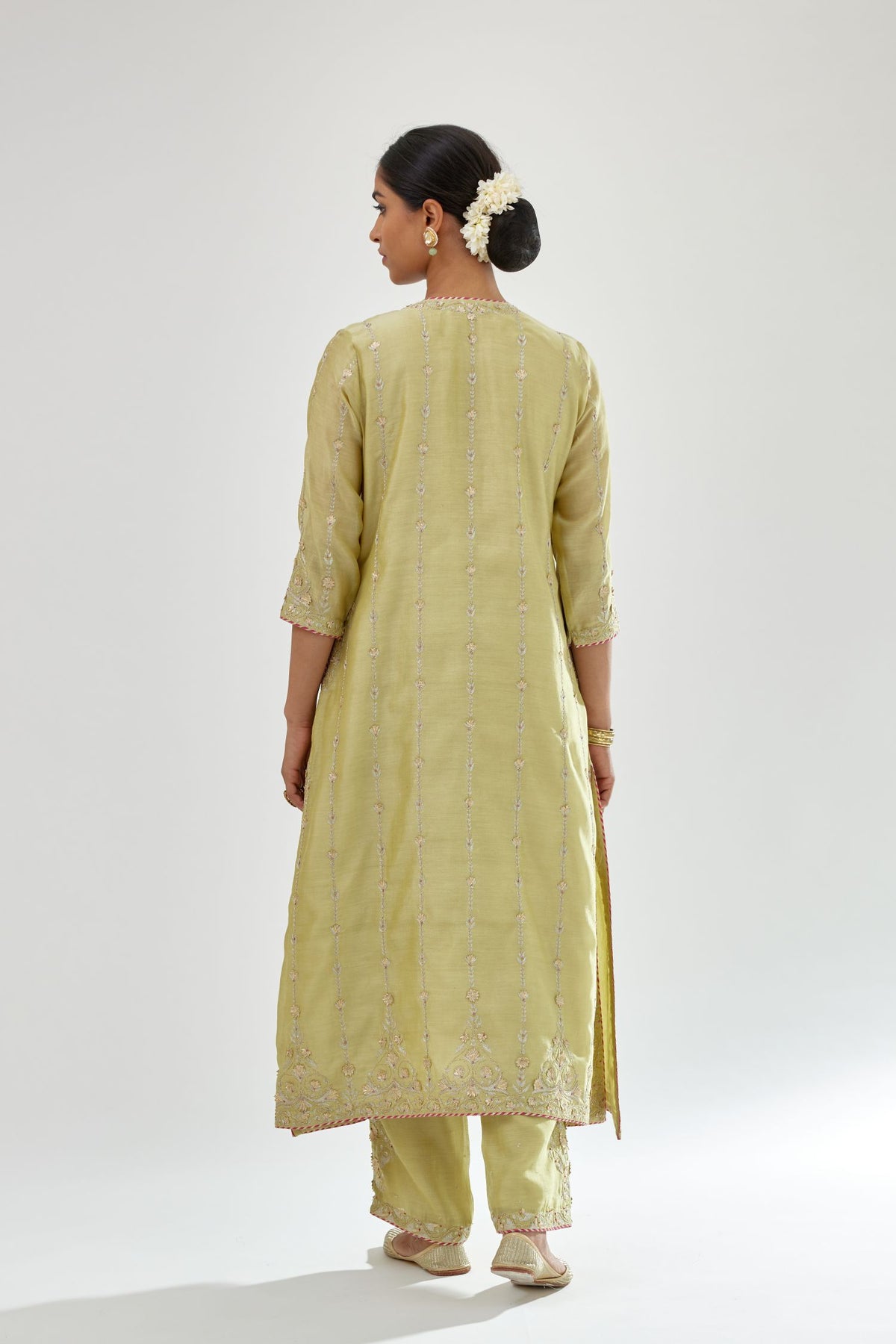 Green silk chanderi straight kurta set with all over heavy dori and gota embroidery work, highlighted with contrast bead work.